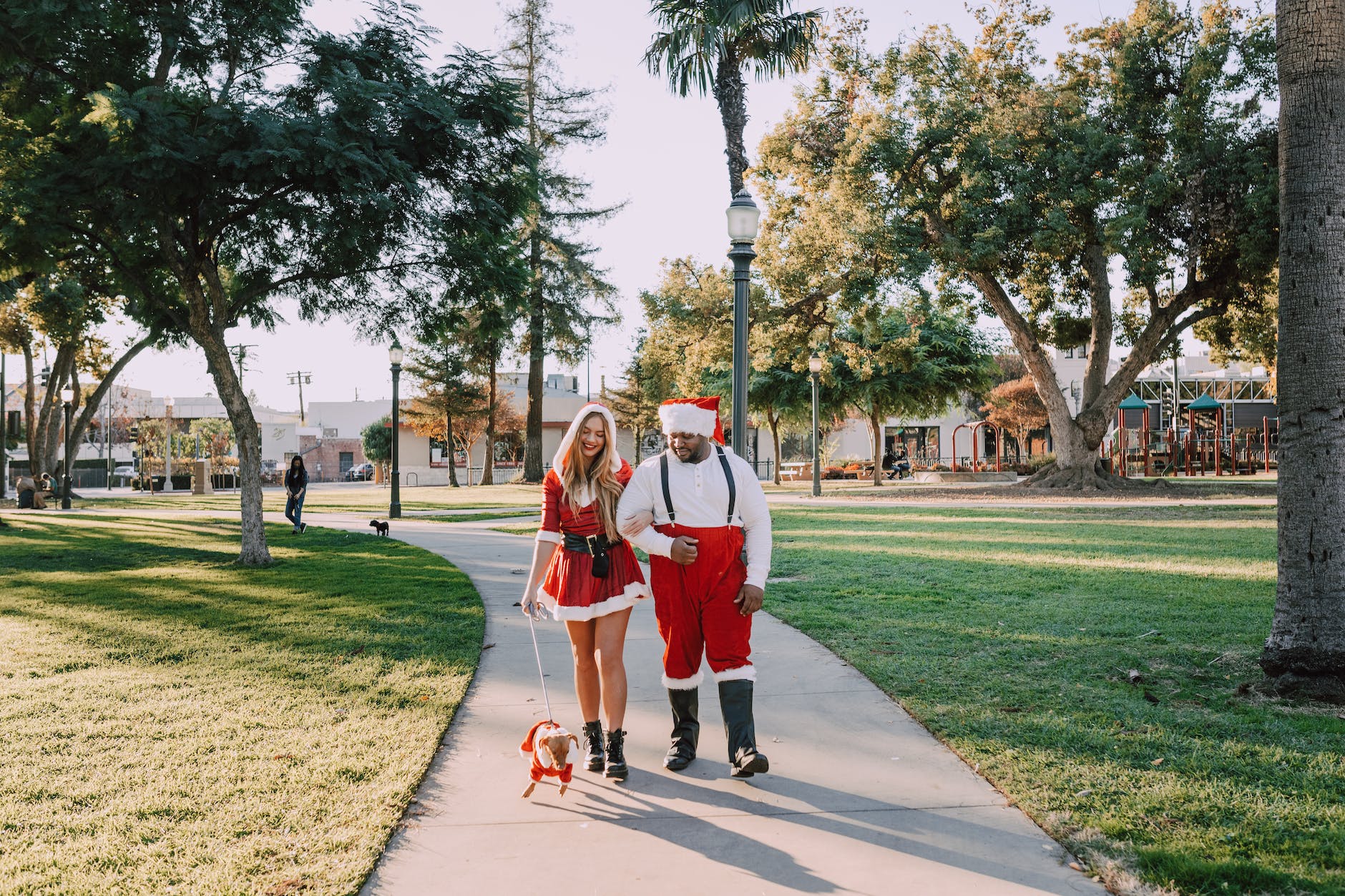 woman in red and white long sleeve shirt and black pants with black leather boots walking