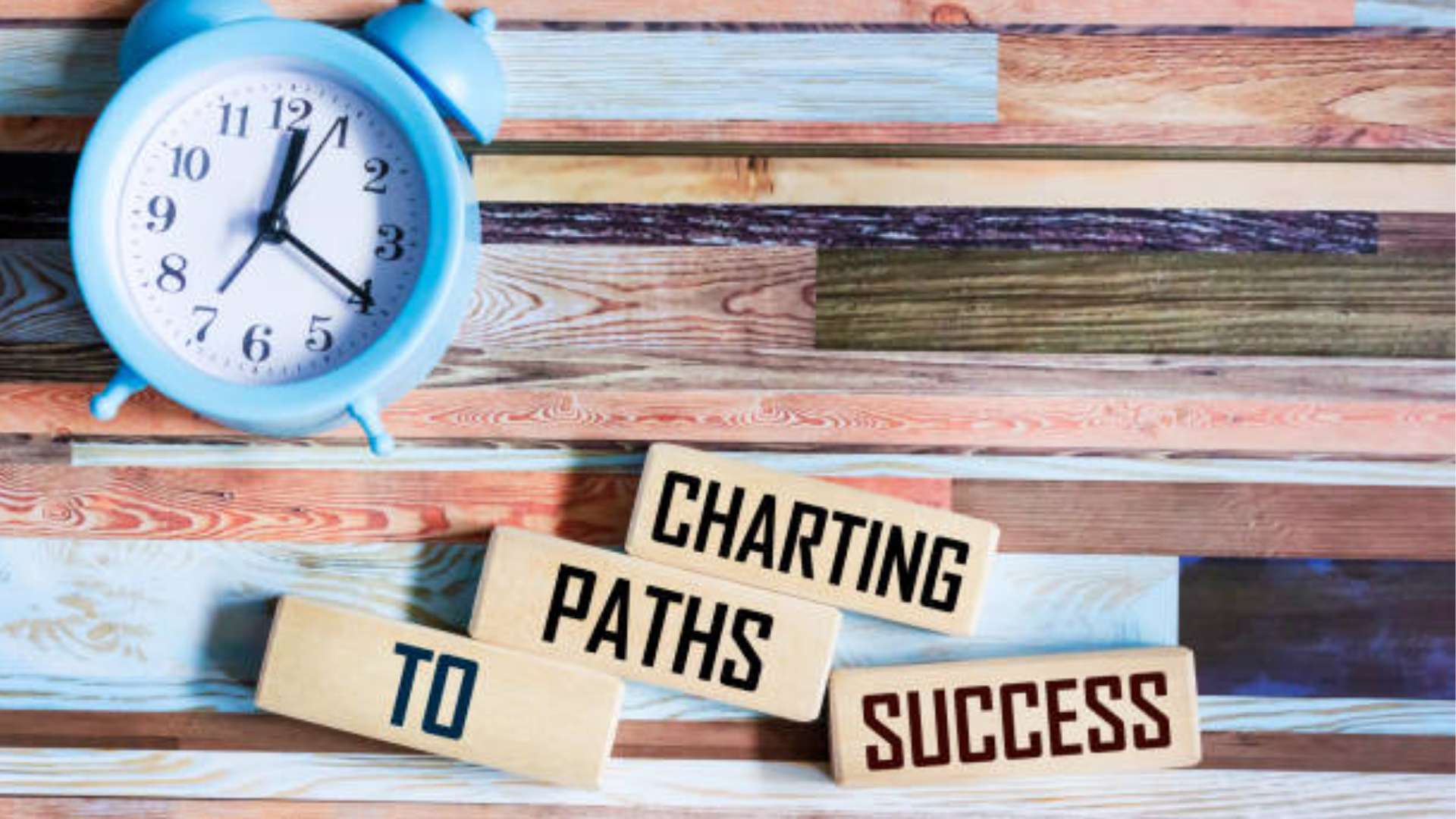 A person writing goals in a journal, focusing on daily progress towards big achievements.