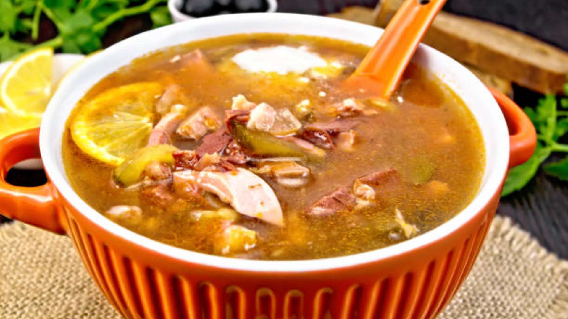 Bowl of hearty spiced turkey soup with sweet potatoes and vegetables