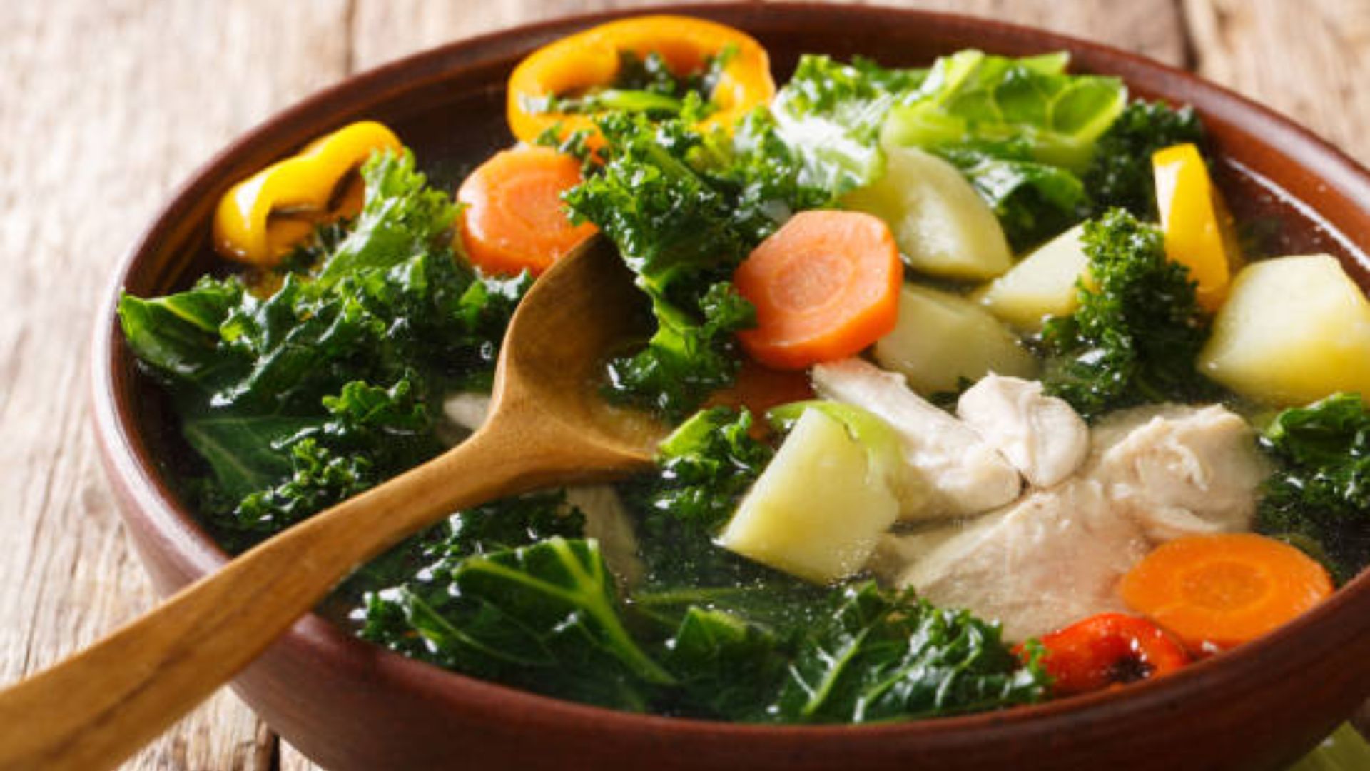 Slow Cooker Turkey & Kale Soup in a bowl, perfect for a healthy dinner.