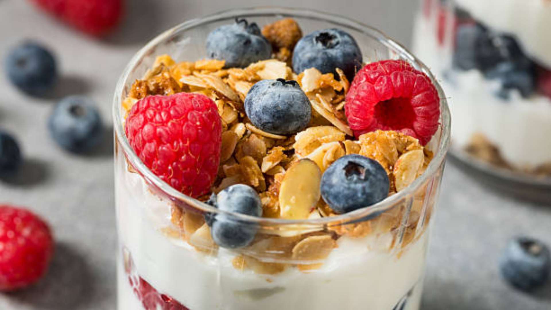 A delicious breakfast protein parfait with layers of yogurt, fruit, and granola.