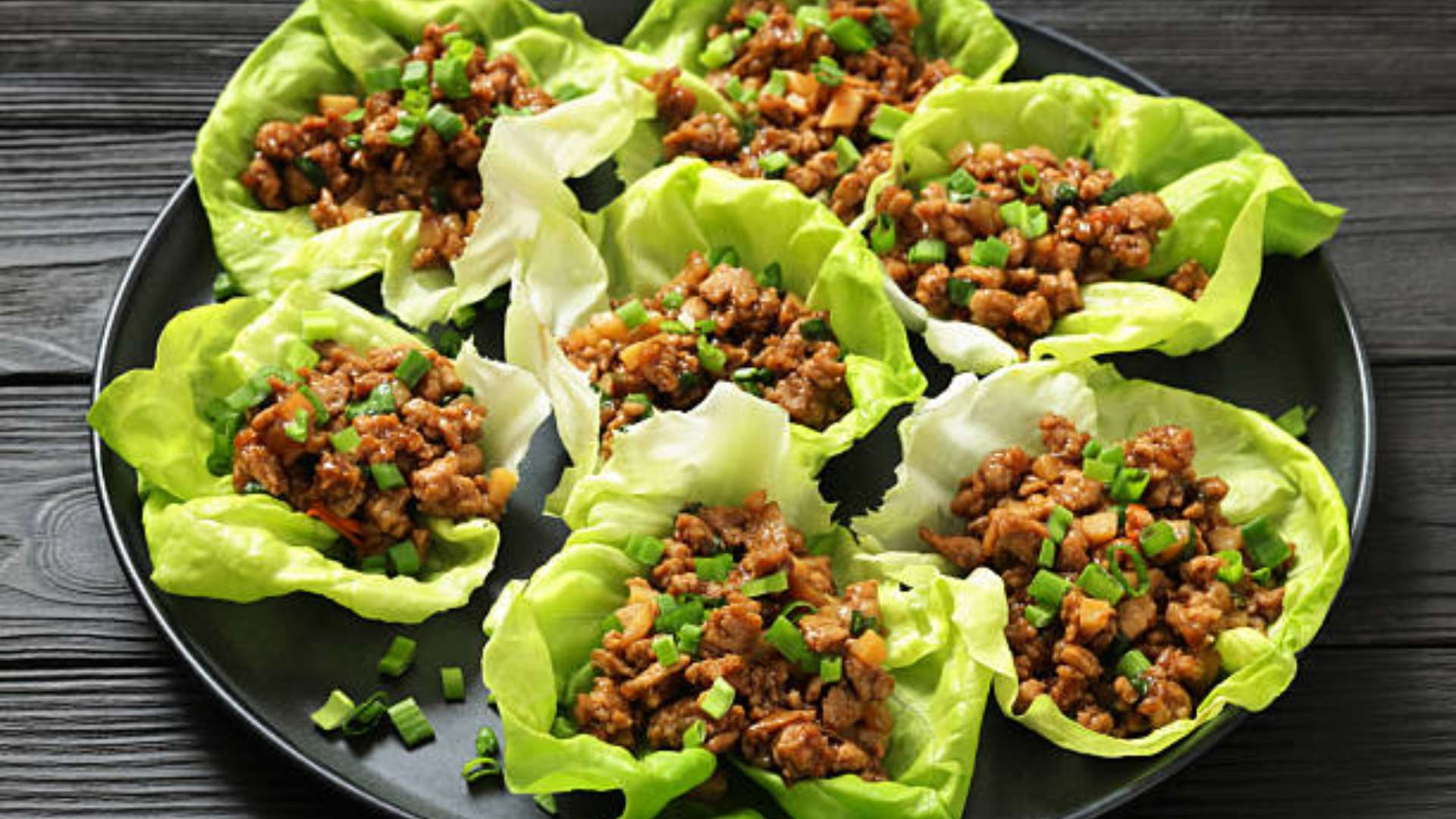 Chicken Lettuce Boats filled with seasoned chicken, fresh veggies, and herbs.