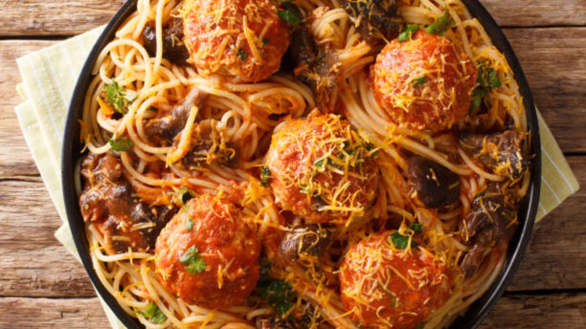 Low-carb spaghetti and meatballs with fresh basil and tomato sauce.
