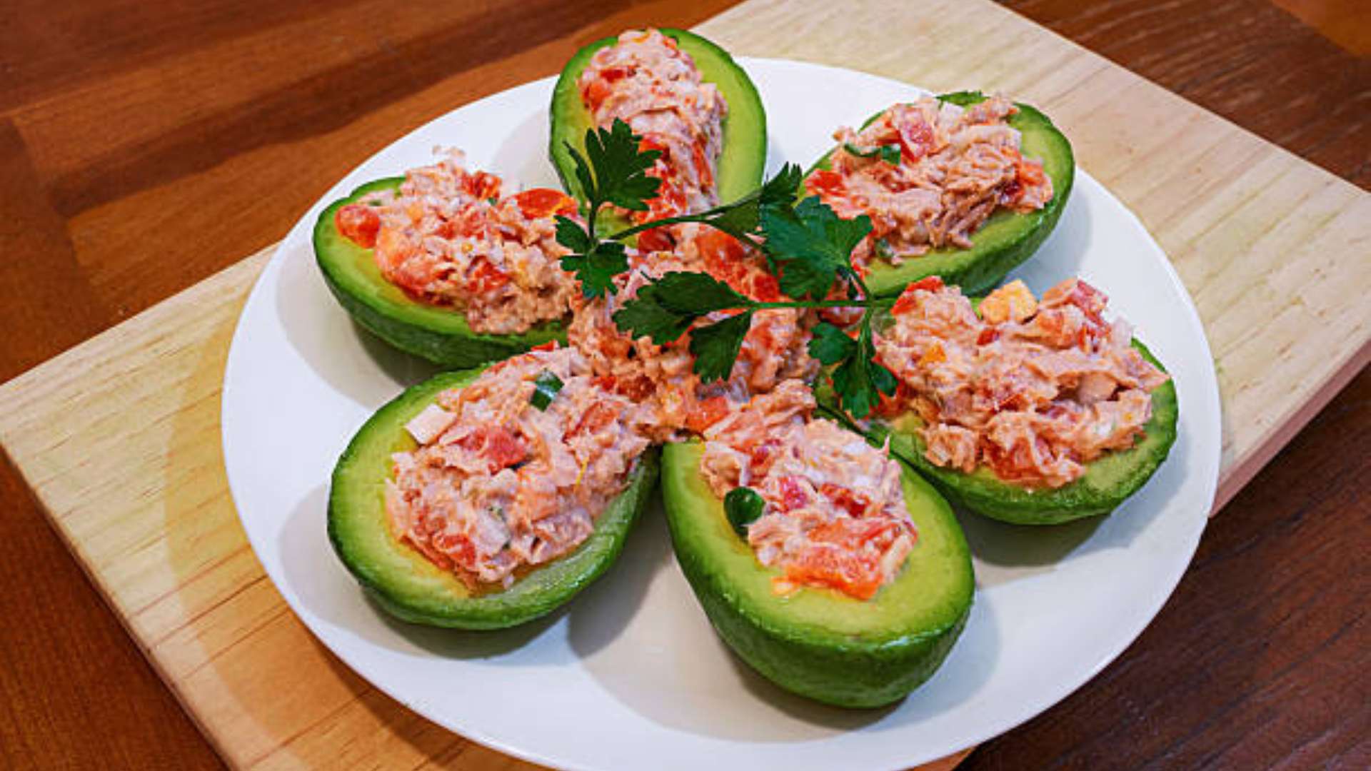 Dressed avocado with lemon, paprika, and cumin for a flavorful snack