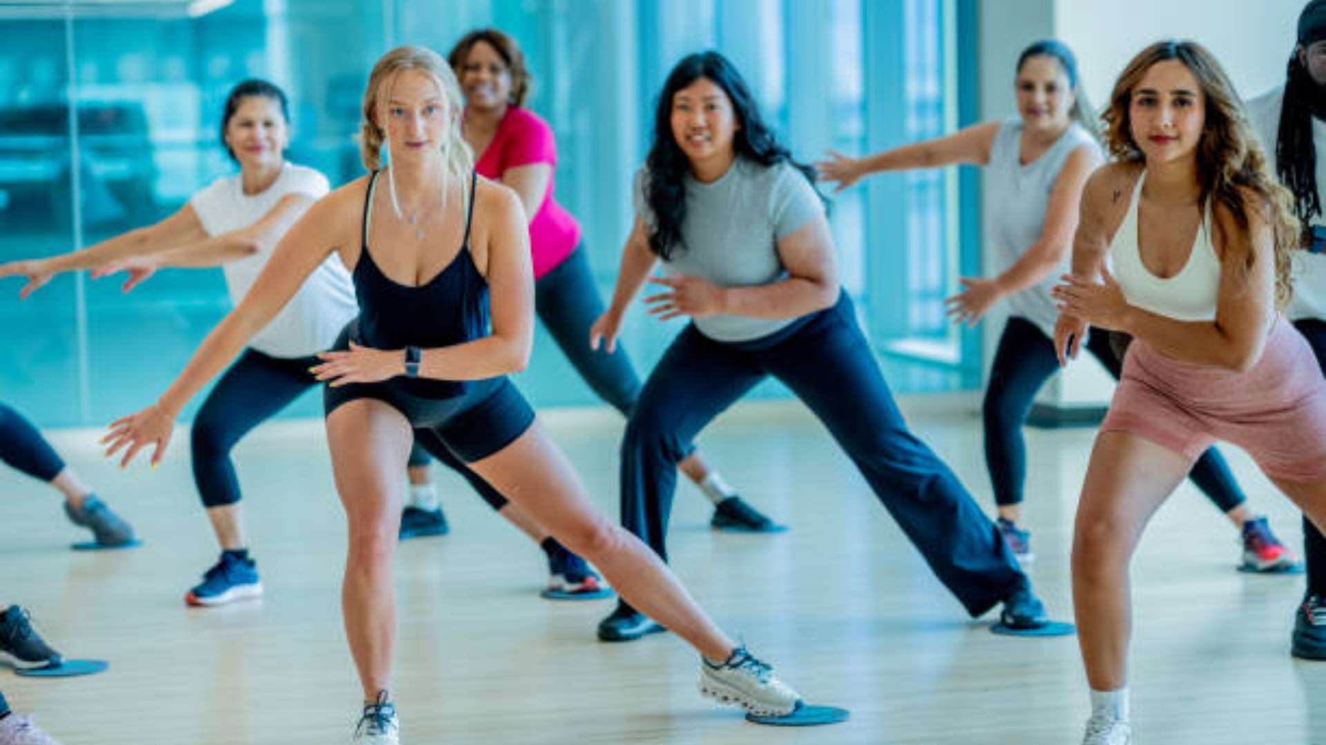 Person working at desk and taking a quick break to stretch and burn calories.