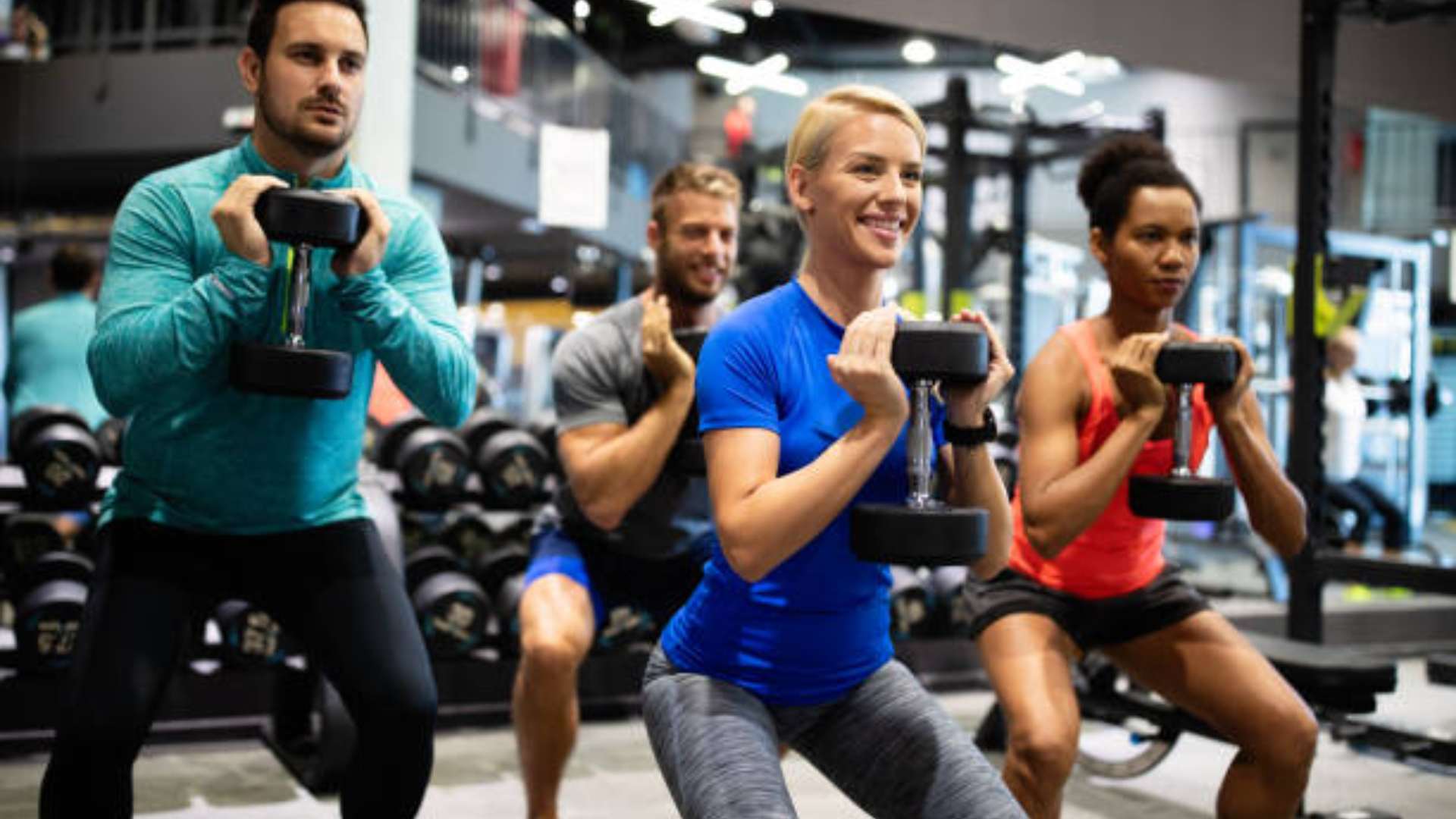 Personal trainer helping client achieve fitness goals in San Diego.