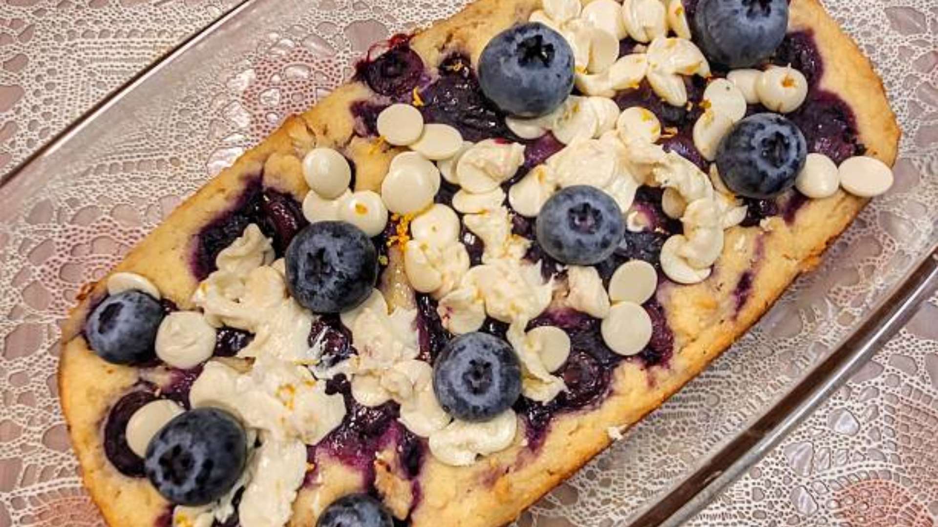 Freshly made lemon blueberry protein bars on a plate.